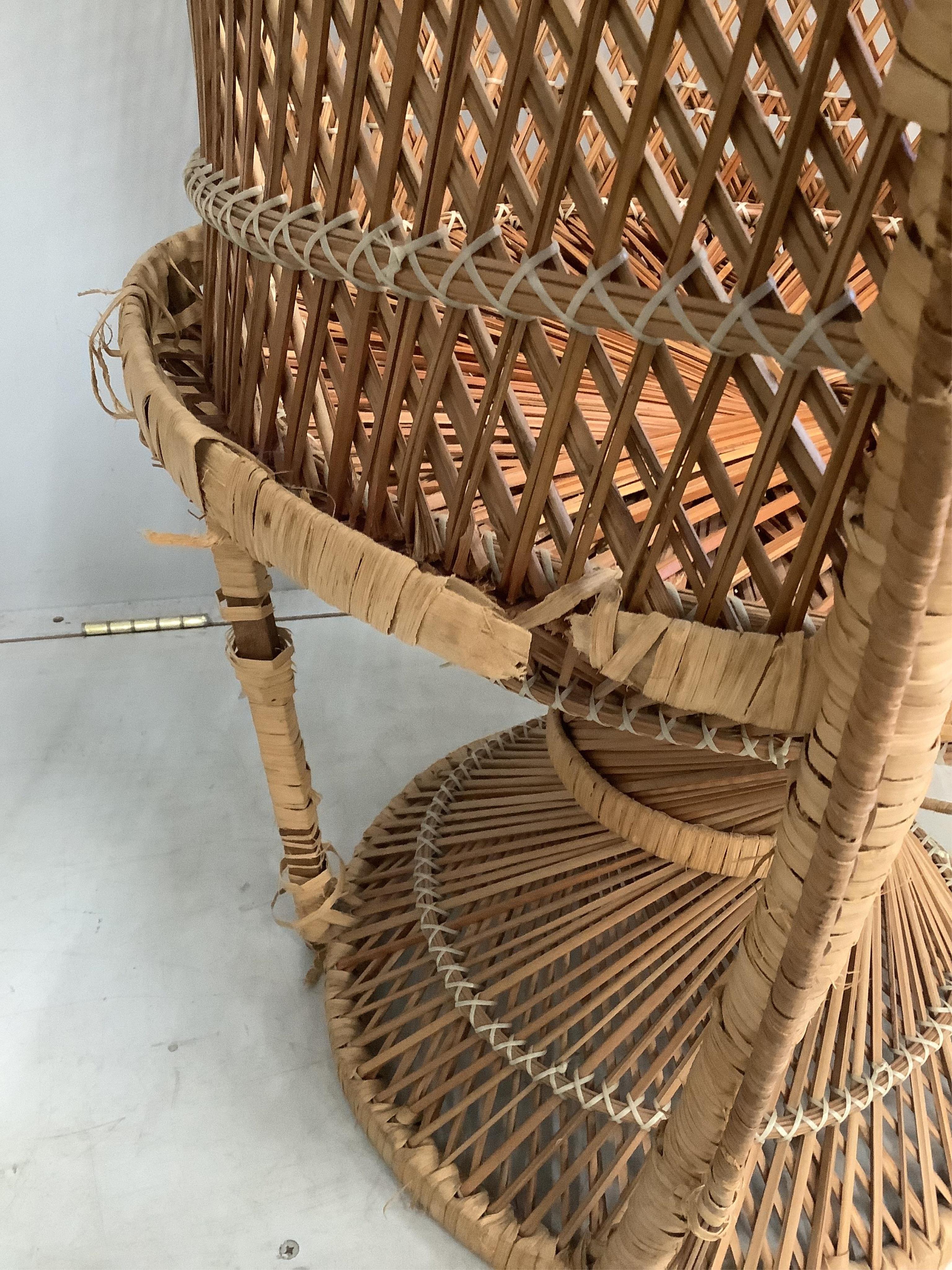 A rattan elbow chair, width 82cm, height 130cm together with a three fold screen
